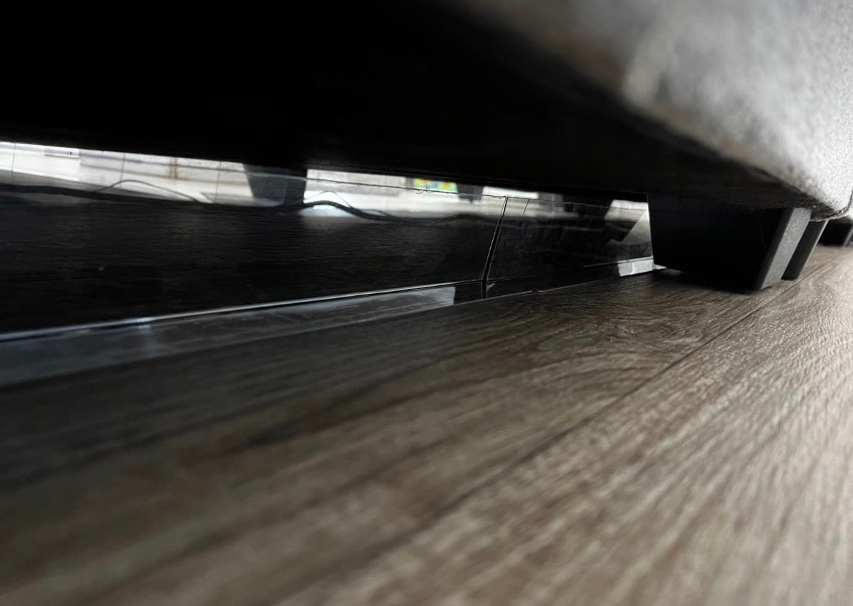 Tebeary blockers installed beneath a sofa